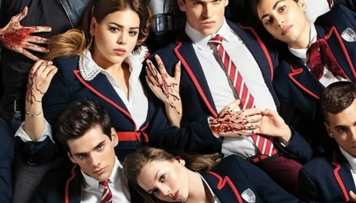 atores e atrizes de elite caracterizados como seus personagens na série